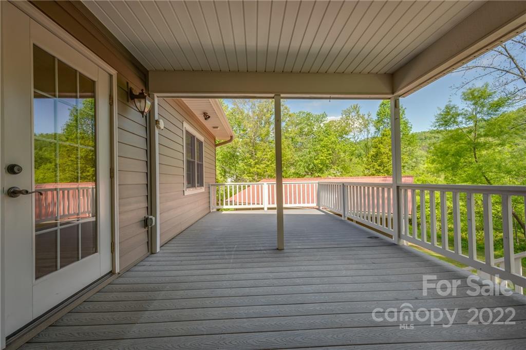 67 Souther Road Fletcher, NC 28732 - Photo 15 of 39 a view of porch with furniture and floor to ceiling window