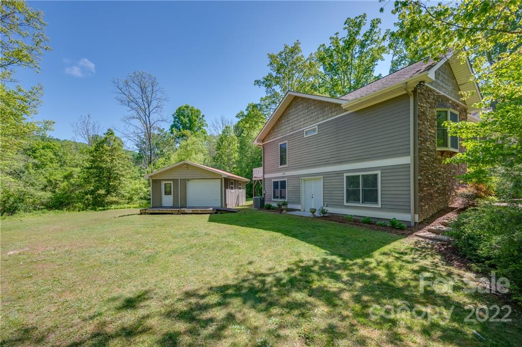 67 Souther Road Fletcher, NC 28732 - Photo 36 of 39 a front view of house with yard and trees