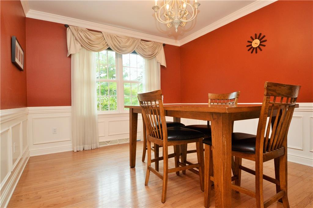 1300 Sara Court Coraopolis, PA 15108 - Photo 15 of 50 a view of a dining room with furniture window and wooden floor