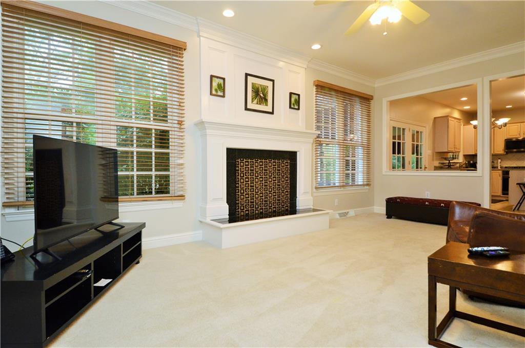 1300 Sara Court Coraopolis, PA 15108 - Photo 18 of 50 a living room with furniture flat screen tv and a fireplace