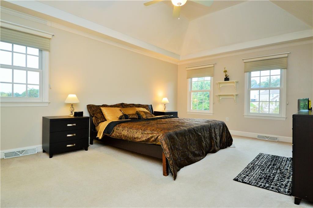 1300 Sara Court Coraopolis, PA 15108 - Photo 22 of 50 a spacious bedroom with a bed and window