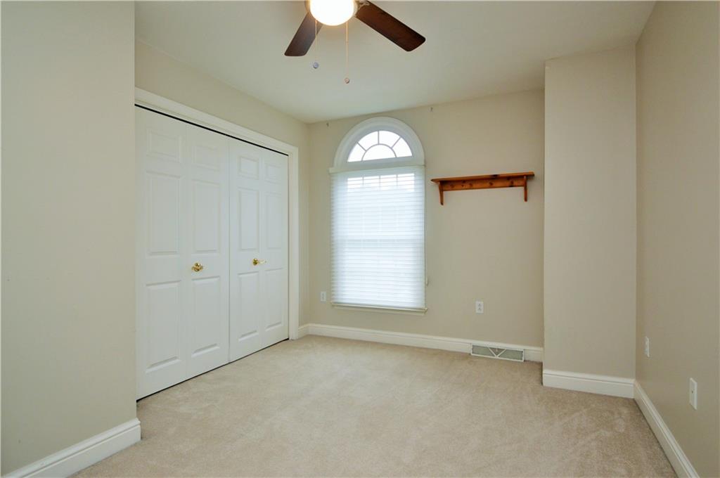 1300 Sara Court Coraopolis, PA 15108 - Photo 28 of 50 an empty room with chandelier fan and windows