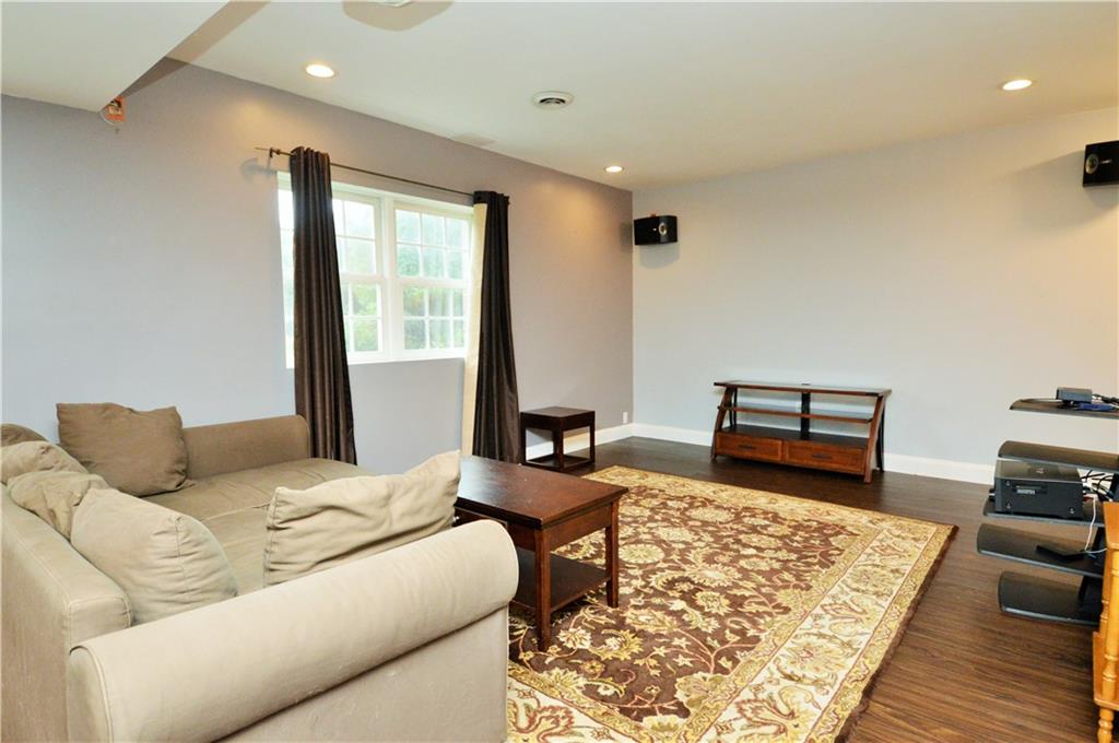 1300 Sara Court Coraopolis, PA 15108 - Photo 36 of 50 a bedroom with a bed and wooden floor