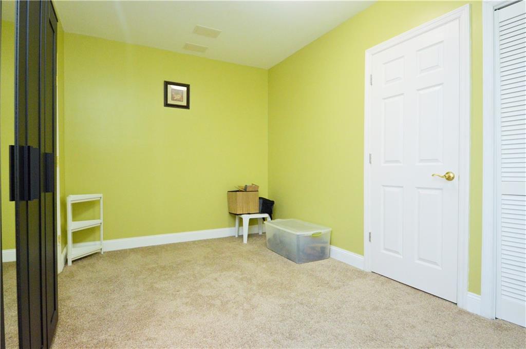1300 Sara Court Coraopolis, PA 15108 - Photo 42 of 50 a room with a chair and a white door