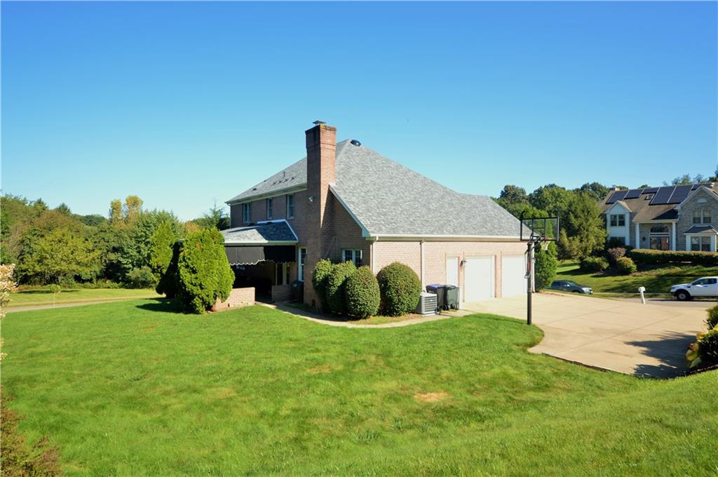 1300 Sara Court Coraopolis, PA 15108 - Photo 5 of 50 a view of a house with a yard and sitting area