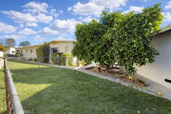 a view of a backyard of the house