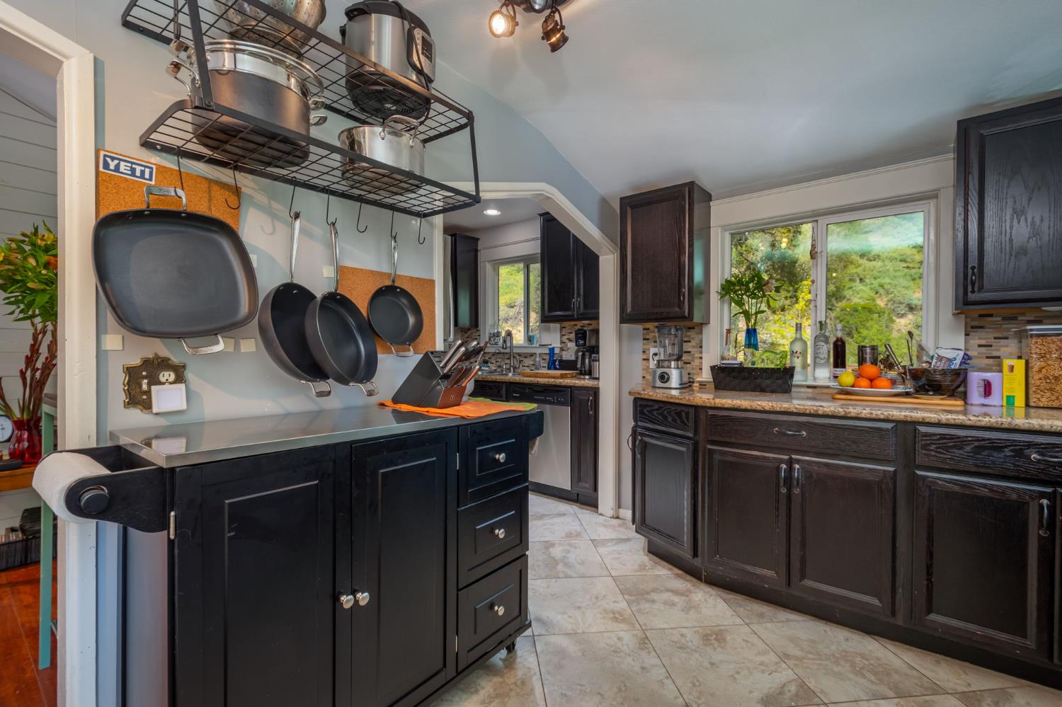 15663 Ojai Road Santa Paula, CA 93060 - Photo 8 of 47 a kitchen with a sink stove and cabinets
