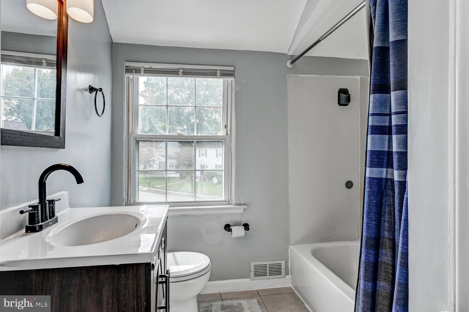 2636 Spring Road Baltimore, MD 21234 - Photo 16 of 25 a bathroom with a sink toilet and shower