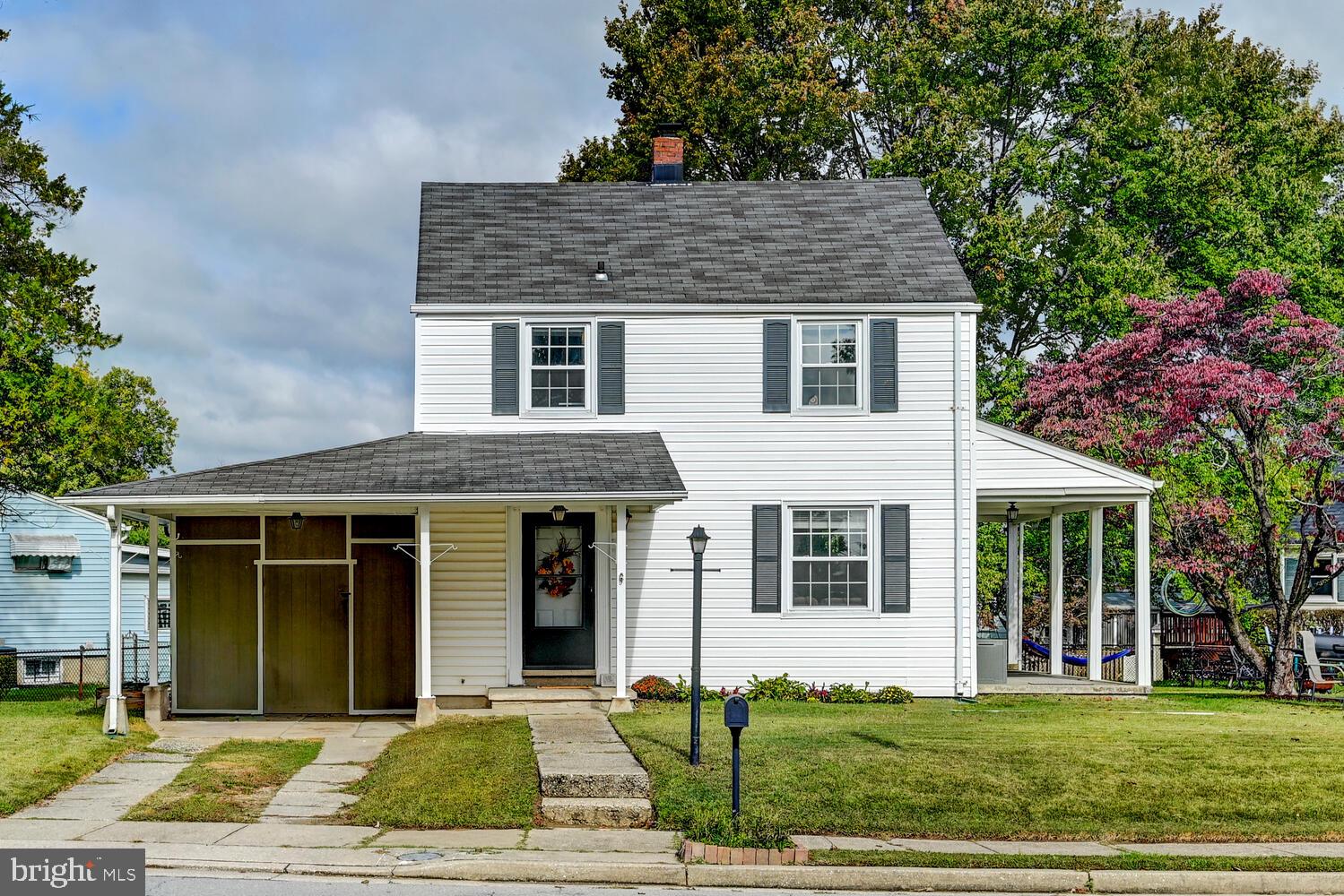 2636 Spring Road Baltimore, MD 21234 - Photo 2 of 25 a front view of a house with a yard