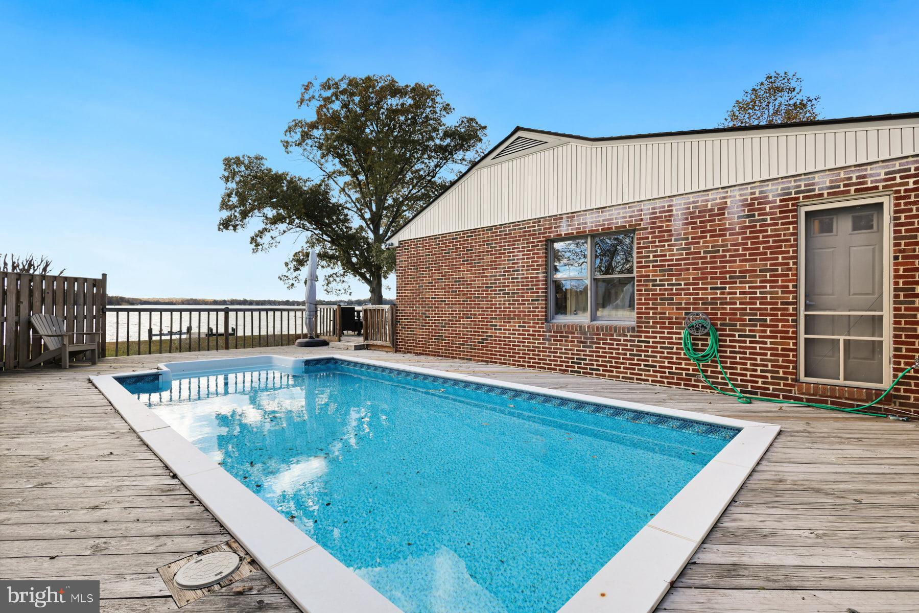 3258 Harness Creek Road Annapolis, MD 21403 - Photo 13 of 34 a view of a balcony with wooden floor and fence