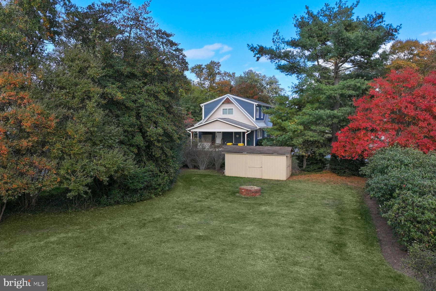 3258 Harness Creek Road Annapolis, MD 21403 - Photo 14 of 34 a view of a white house with a yard and sitting area