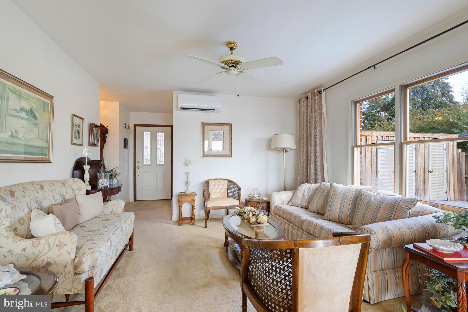 3258 Harness Creek Road Annapolis, MD 21403 - Photo 18 of 34 a living room with furniture and a large window