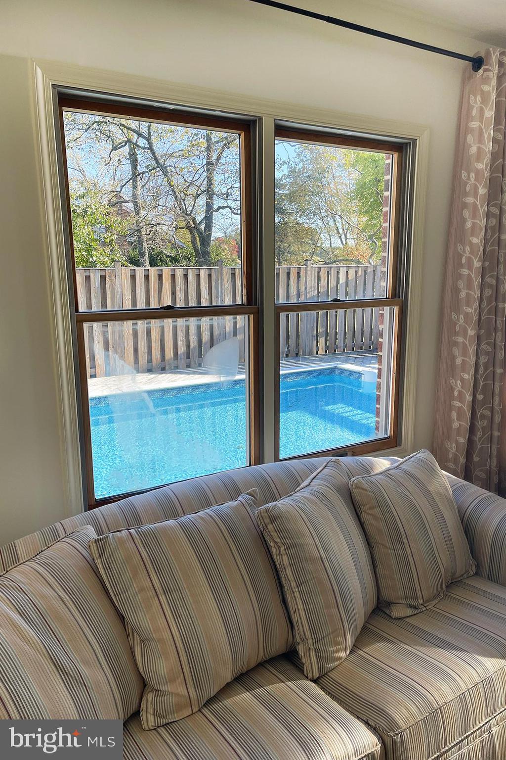 3258 Harness Creek Road Annapolis, MD 21403 - Photo 19 of 34 a bedroom with a large bed and a large window