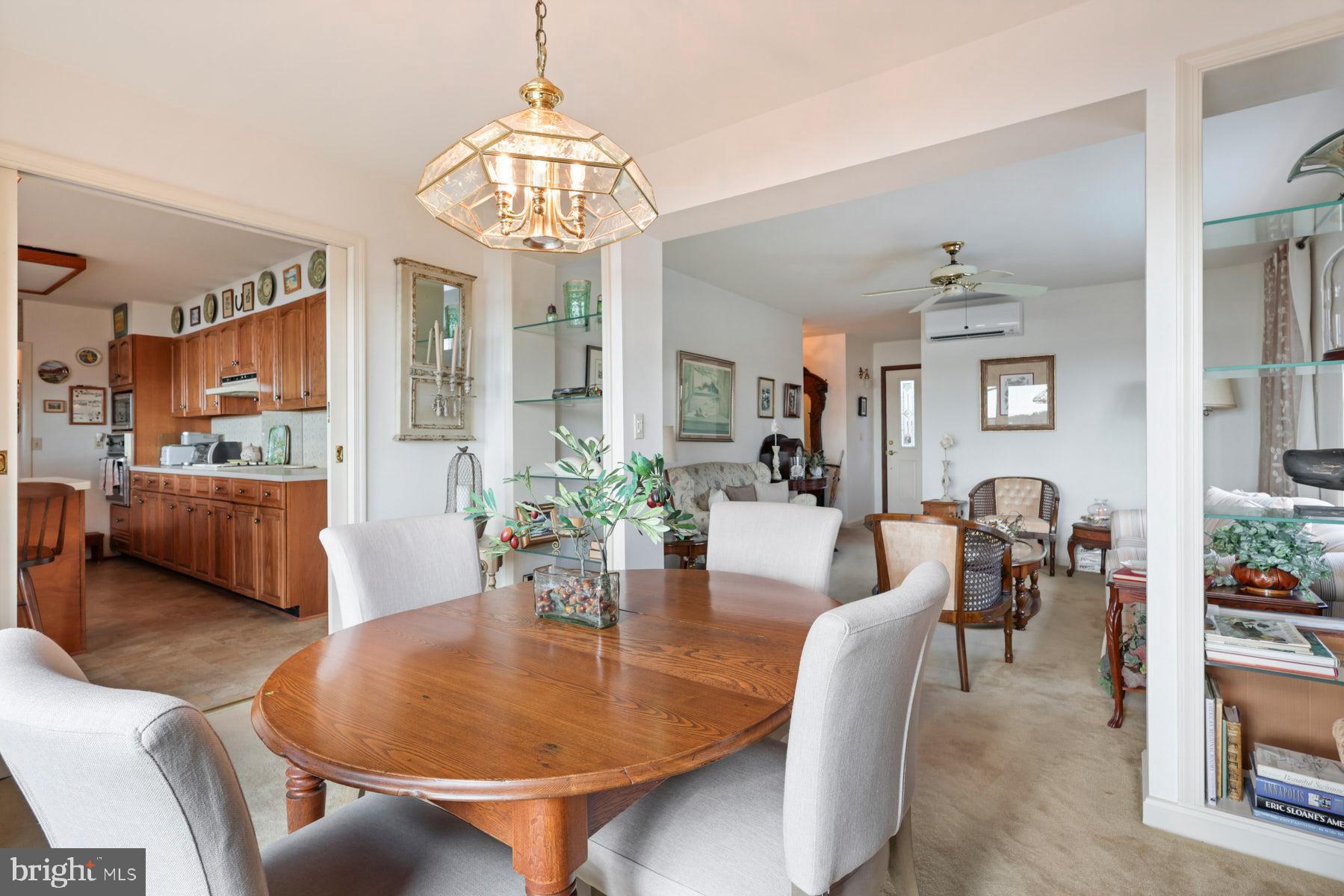 3258 Harness Creek Road Annapolis, MD 21403 - Photo 20 of 34 a dining room with furniture a livingroom and chandelier