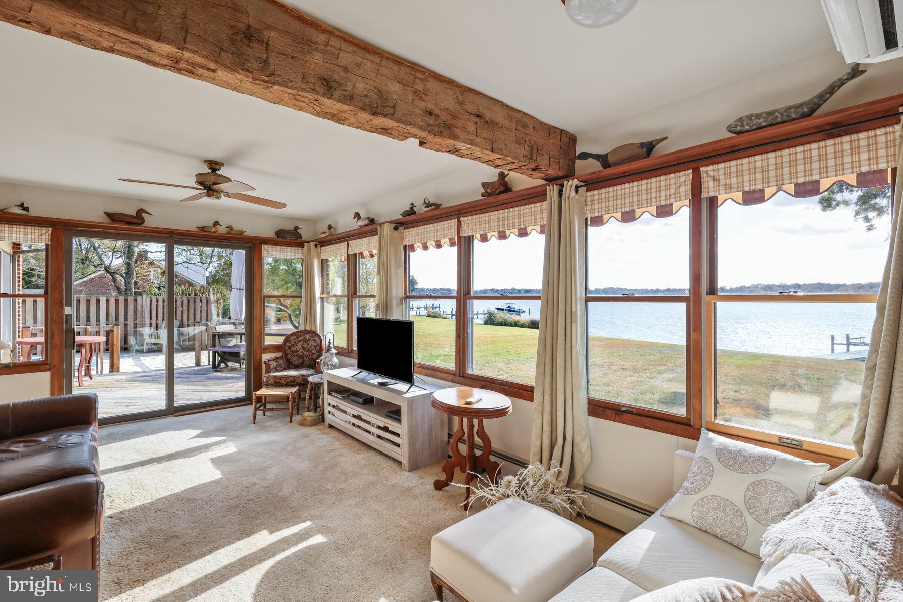 3258 Harness Creek Road Annapolis, MD 21403 - Photo 25 of 34 a living room with furniture and large windows