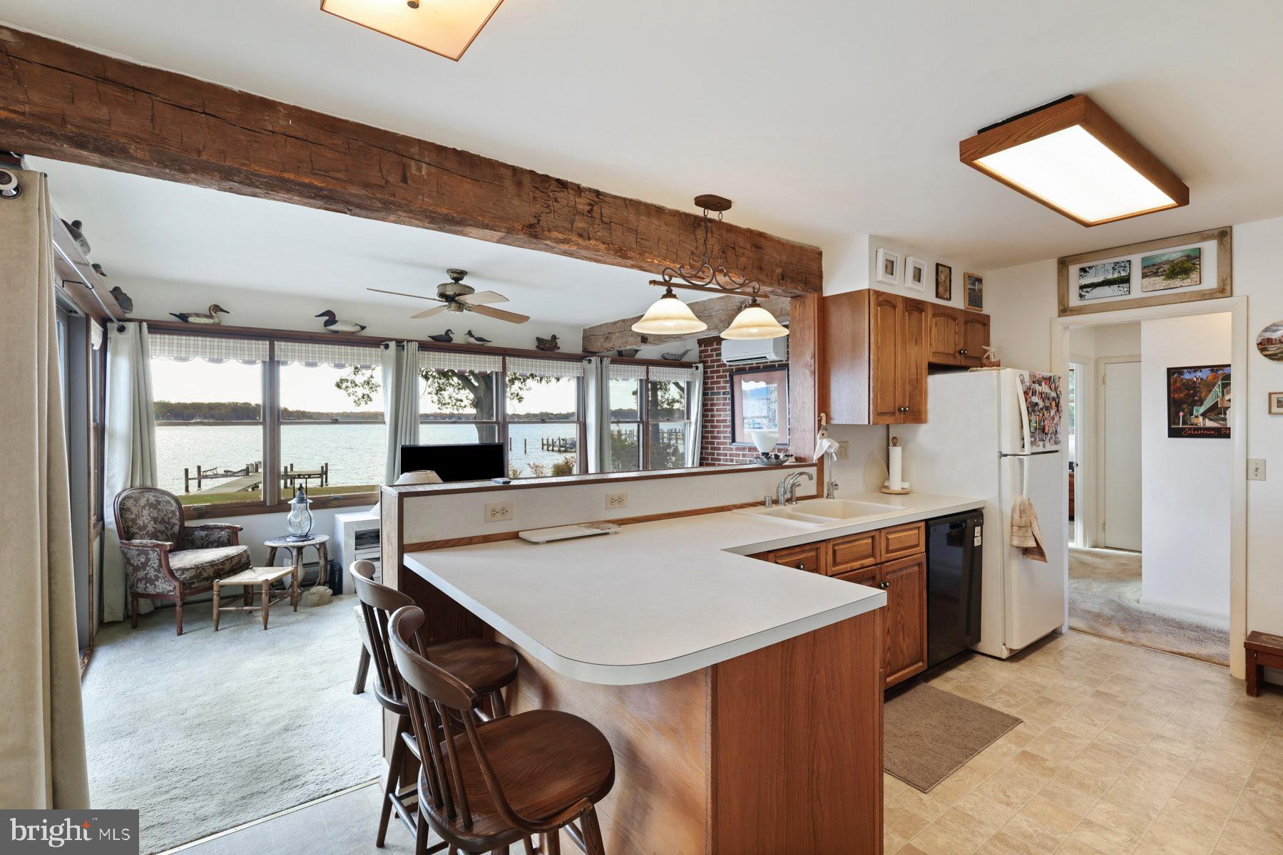 3258 Harness Creek Road Annapolis, MD 21403 - Photo 29 of 34 a dining hall with stainless steel appliances granite countertop a sink a stove and refrigerator