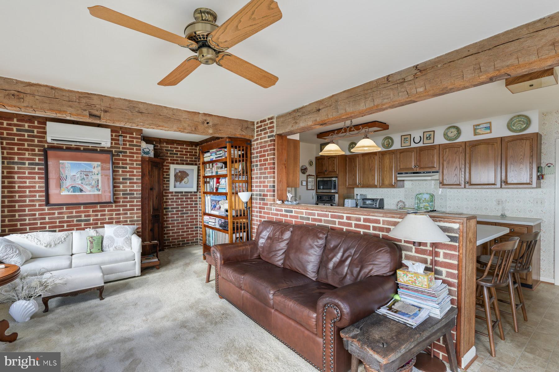 3258 Harness Creek Road Annapolis, MD 21403 - Photo 30 of 34 a living room with furniture and kitchen view