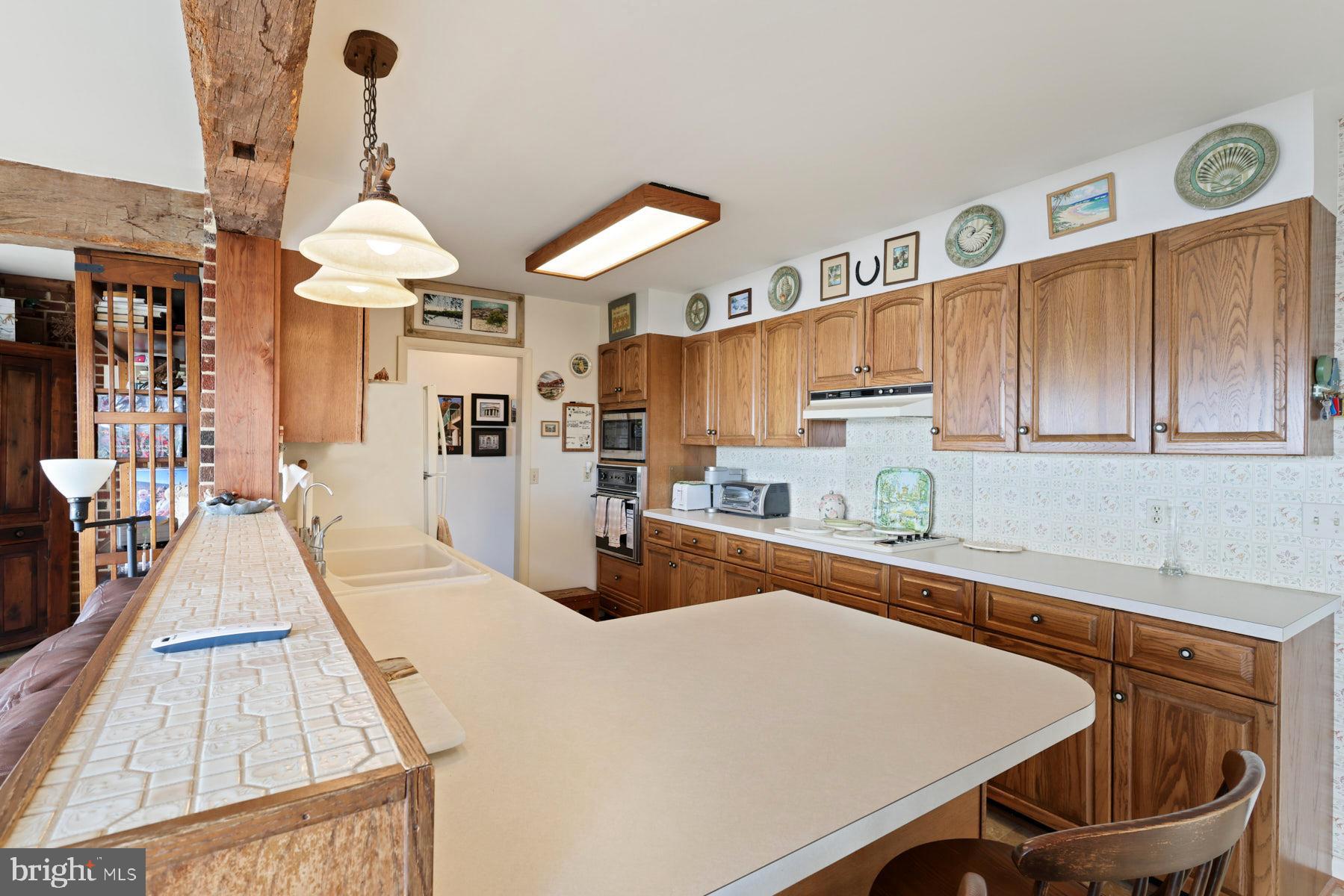 3258 Harness Creek Road Annapolis, MD 21403 - Photo 32 of 34 a kitchen with stainless steel appliances granite countertop a sink and cabinets