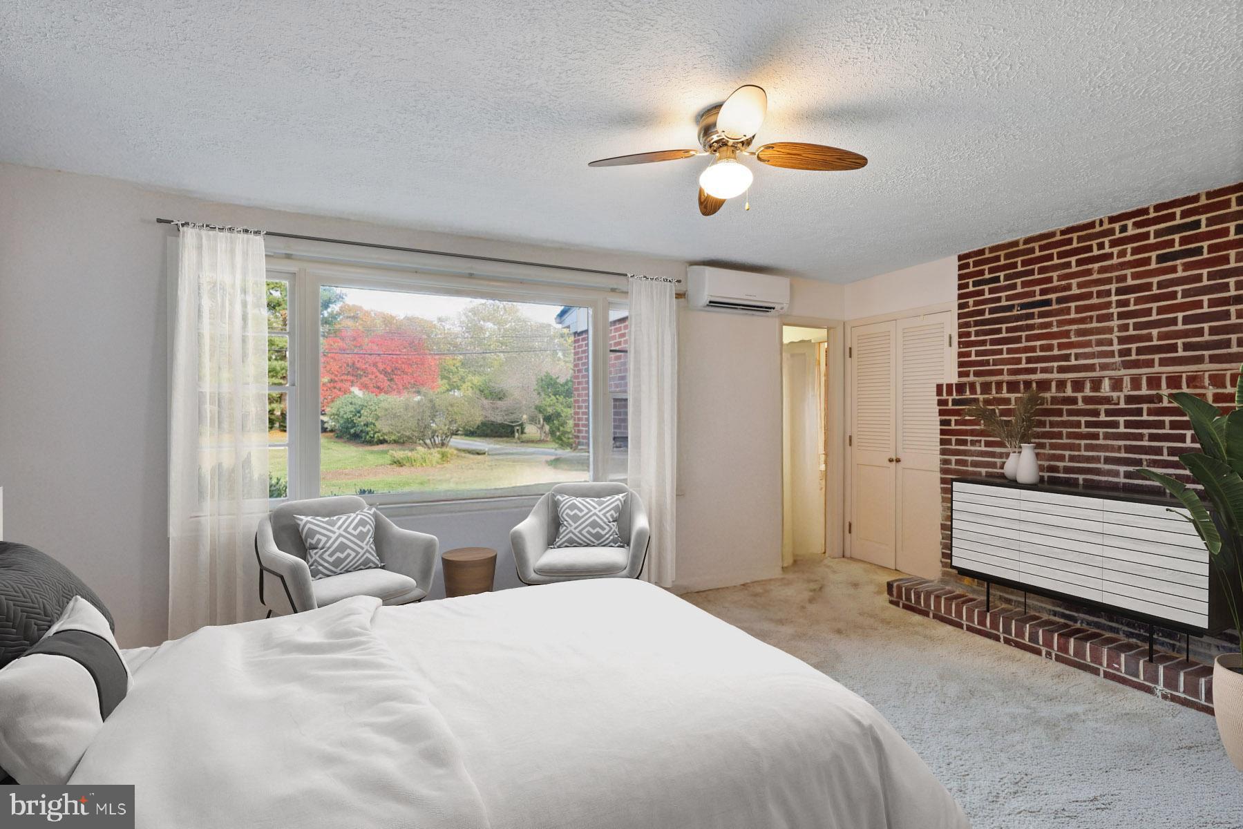3258 Harness Creek Road Annapolis, MD 21403 - Photo 33 of 34 a bedroom with a large bed and a chandelier