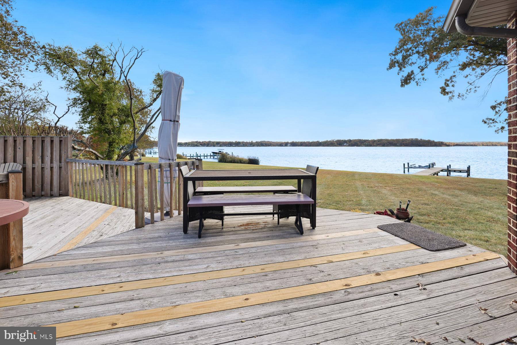 3258 Harness Creek Road Annapolis, MD 21403 - Photo 34 of 34 a view of a terrace with wooden floor and fence