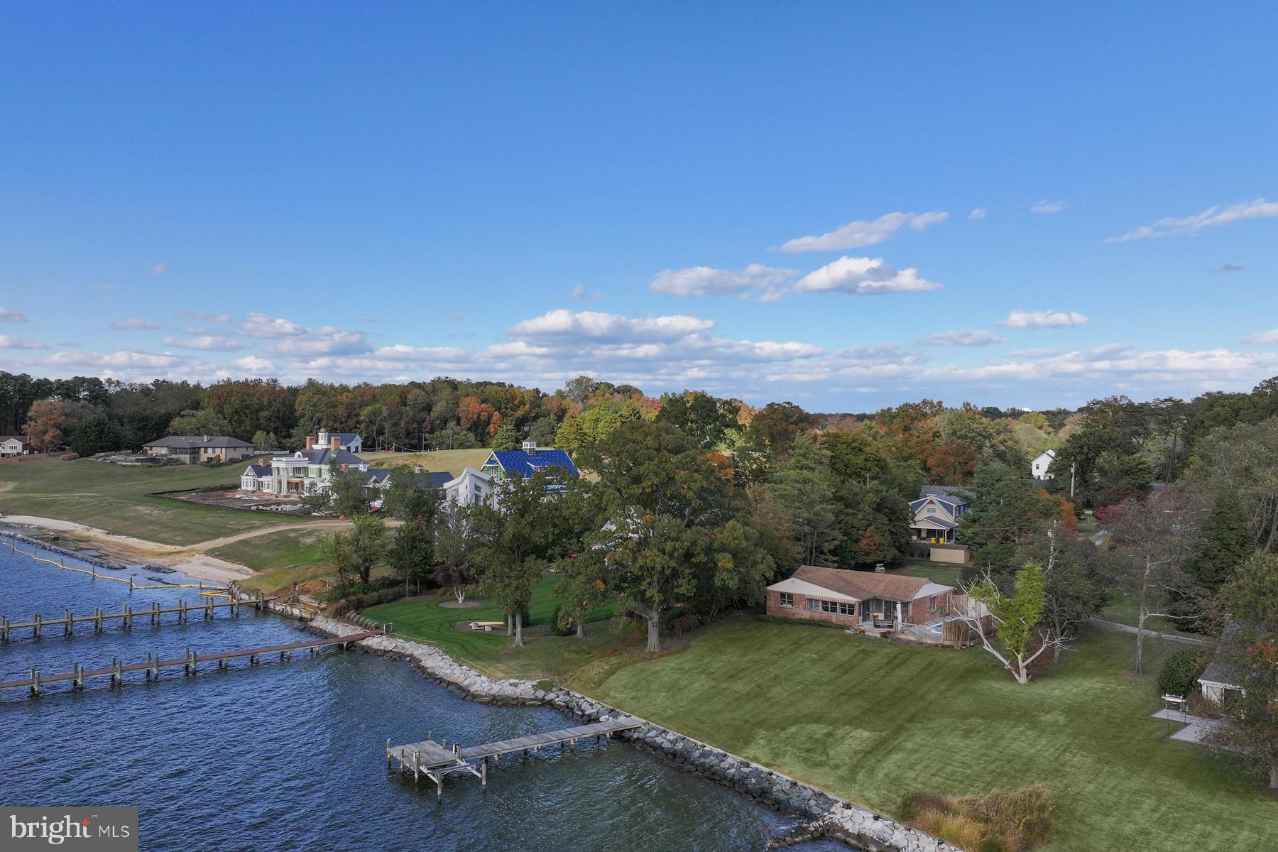 3258 Harness Creek Road Annapolis, MD 21403 - Photo 7 of 34 a view of a lake with a mountain in the background