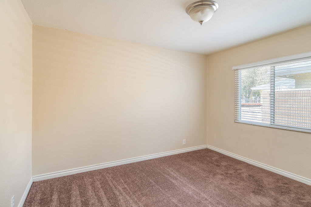 45546 3rd Street East Lancaster, CA 93535 - Photo 17 of 23 an empty room with a empty space and a window