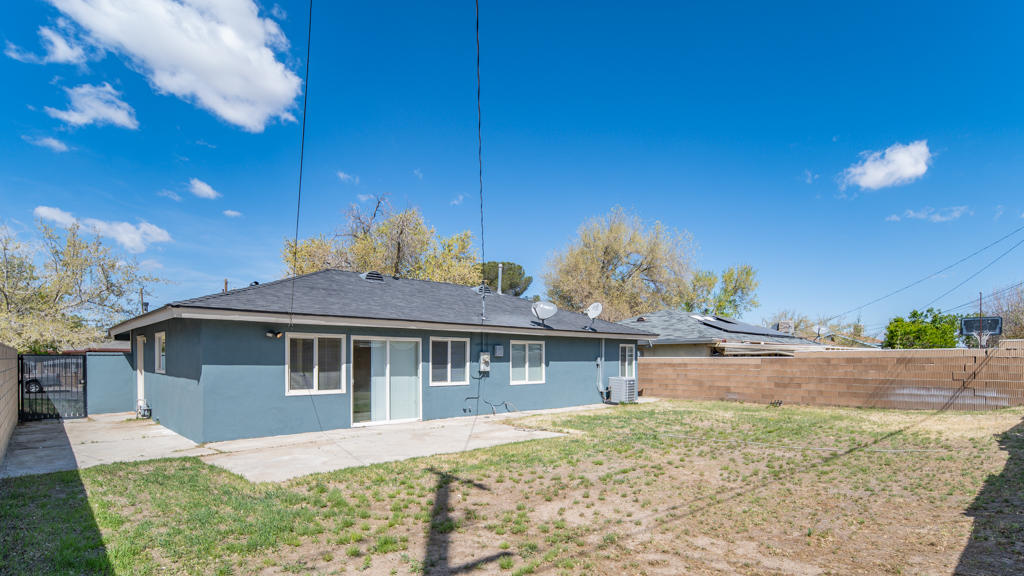 45546 3rd Street East Lancaster, CA 93535 - Photo 20 of 23 a front view of a house with a yard