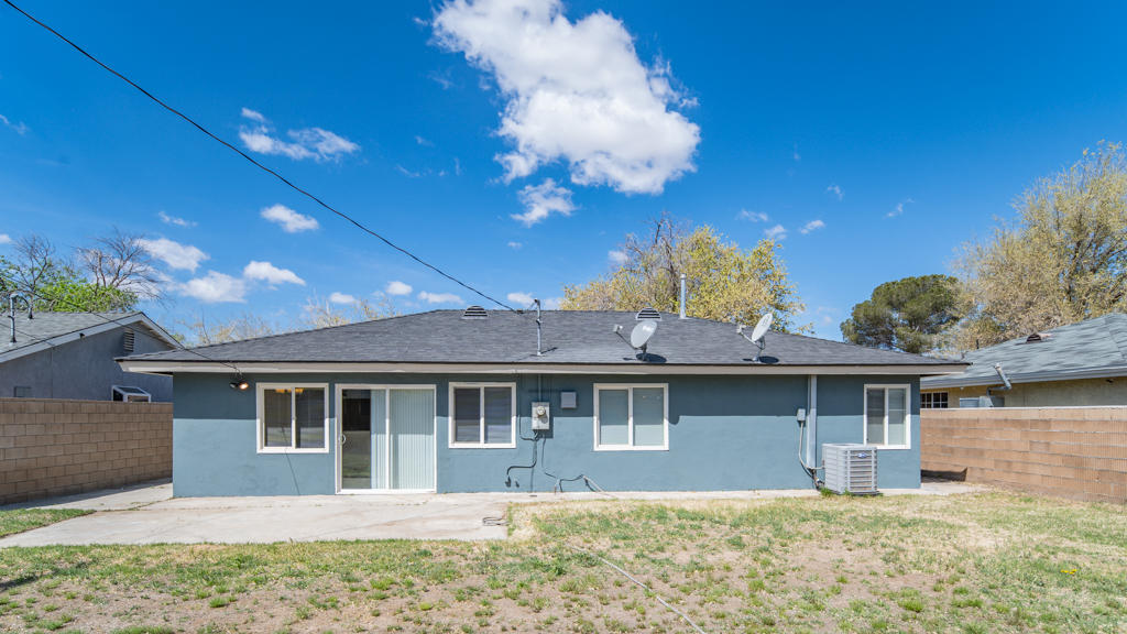 45546 3rd Street East Lancaster, CA 93535 - Photo 21 of 23 a front view of a house with a yard
