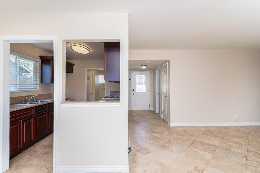 45546 3rd Street East Lancaster, CA 93535 - Photo 7 of 23 a view of a kitchen from the hallway