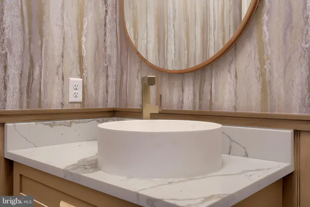 a view of entryway with wooden floor and front door