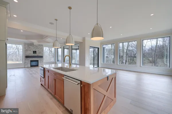 a stove sitting inside of a kitchen with white cabinets