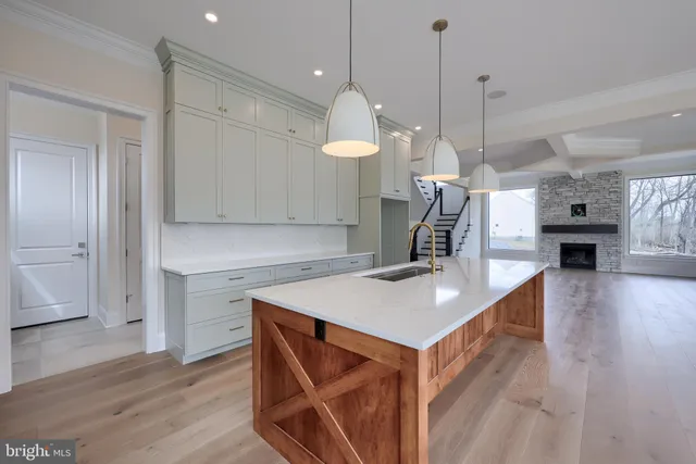 a kitchen with granite countertop a stove and a sink