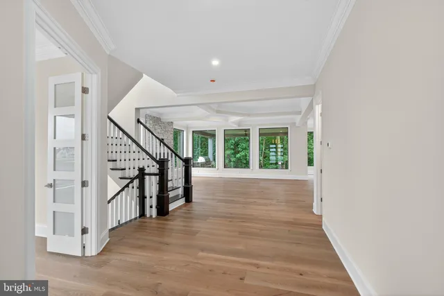 a view of an entryway with wooden floor
