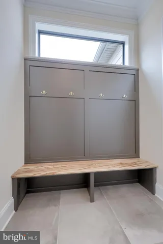 a bathroom with a granite countertop sink a toilet and a mirror