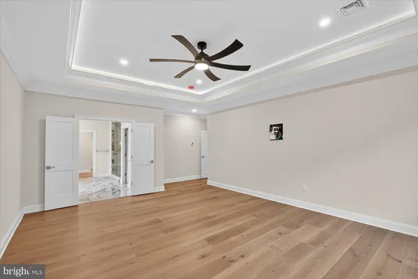 a view of a livingroom with a hard wood floor and window