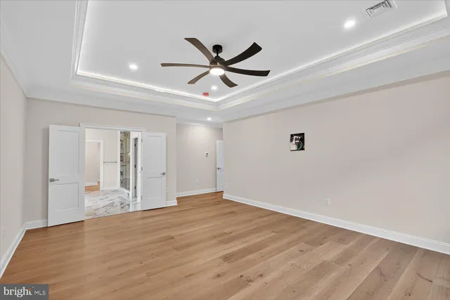 a view of a livingroom with a hard wood floor and window