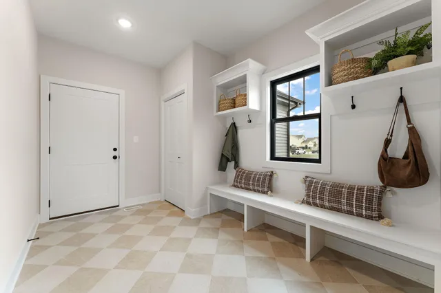 a view of living room filled with furniture and wooden floor