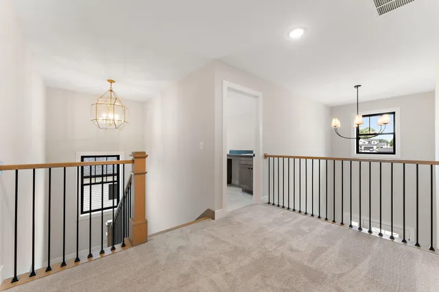 a view of a hallway with windows