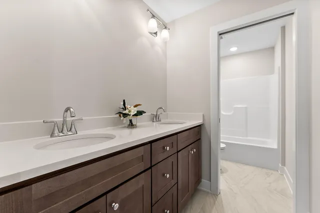 a bathroom with a sink a vanity and a mirror