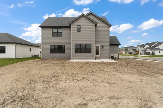 a view of a house with a backyard