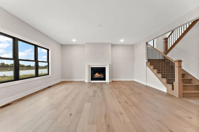 wooden floor in an empty room with a fireplace