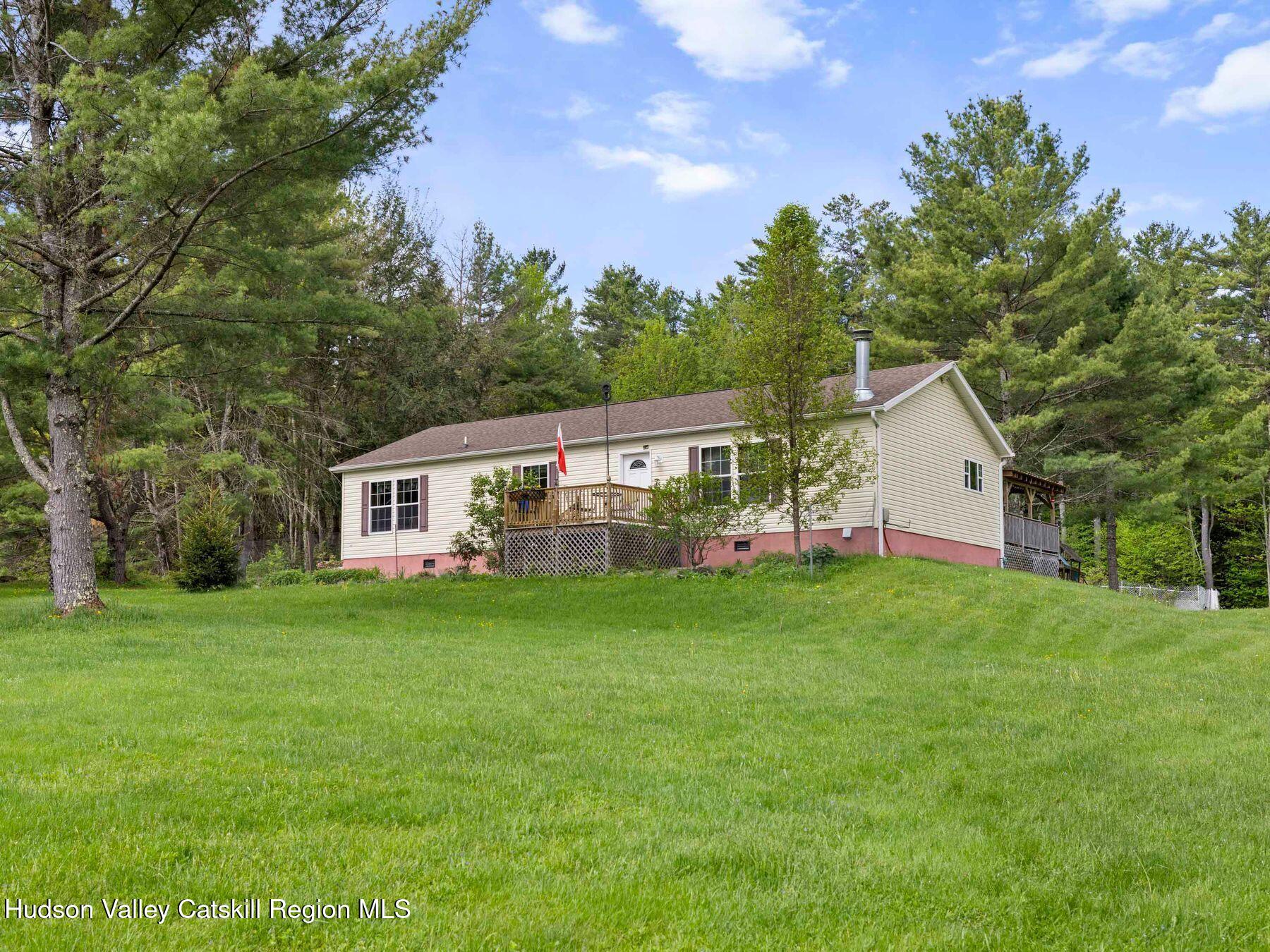 137 Mountain Pond View Road Gilboa, NY 12076 - Photo 2 of 38 a house view with a garden space