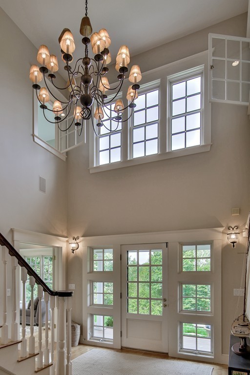 44 Walker Road Manchester, MA 01944 - Photo 11 of 30 a view of a room with a chandelier furniture and windows
