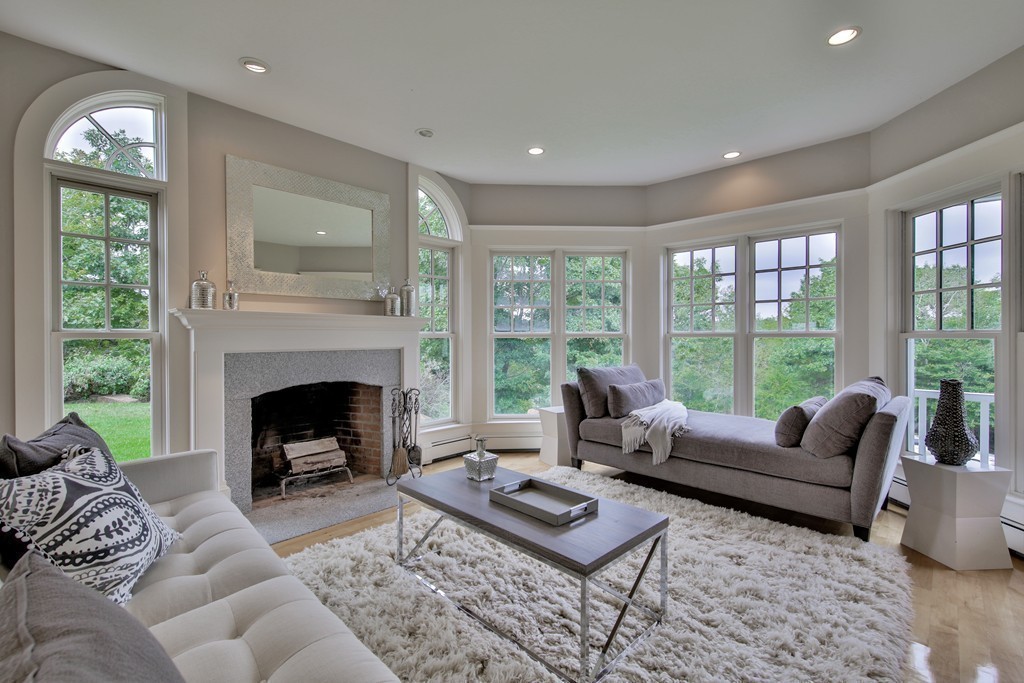 44 Walker Road Manchester, MA 01944 - Photo 12 of 30 a living room with furniture a large window and a fireplace