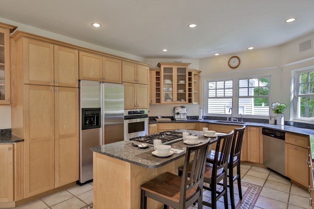 44 Walker Road Manchester, MA 01944 - Photo 17 of 30 a kitchen with stainless steel appliances granite countertop a stove a sink a microwave and a refrigerator