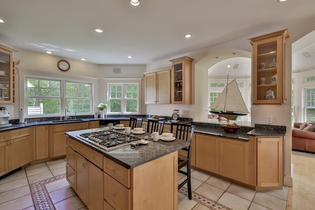 44 Walker Road Manchester, MA 01944 - Photo 18 of 30 a kitchen with granite countertop a sink stove and cabinets