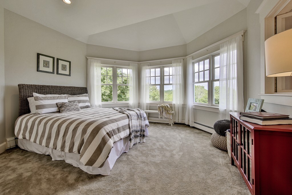 44 Walker Road Manchester, MA 01944 - Photo 23 of 30 a spacious bedroom with a bed and a couch