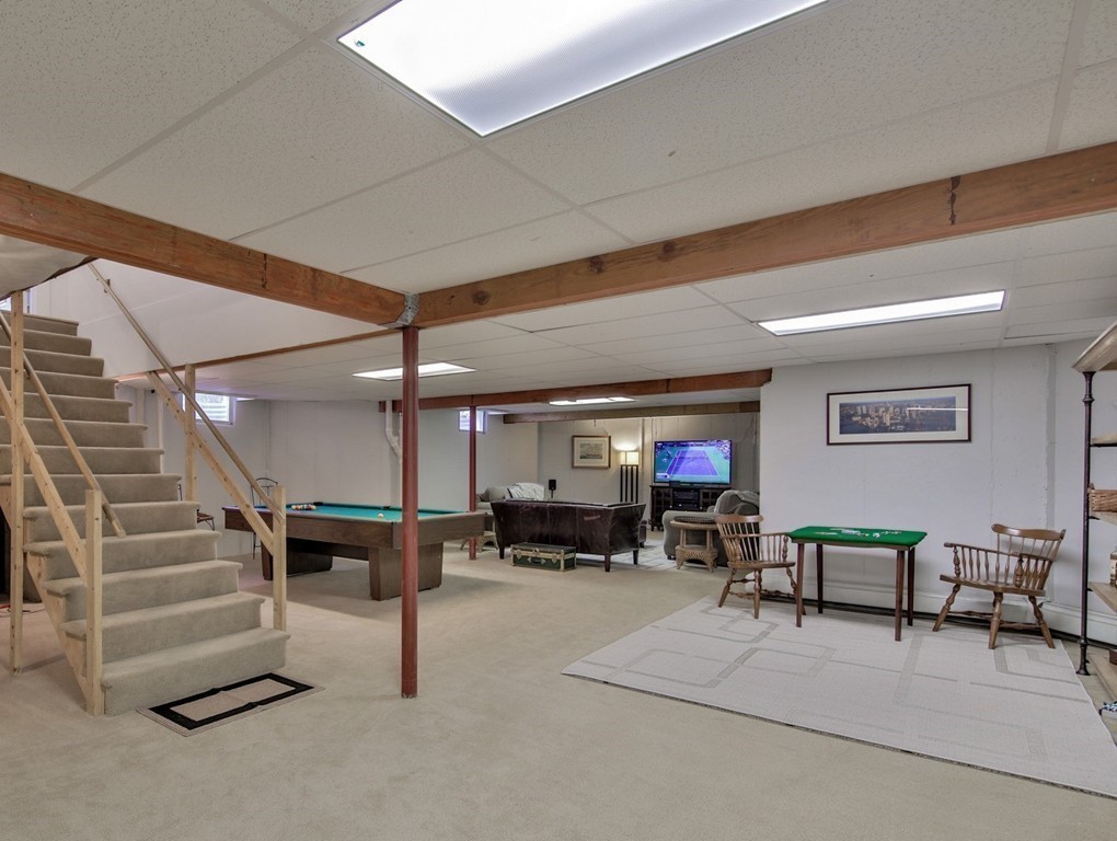 44 Walker Road Manchester, MA 01944 - Photo 26 of 30 a living room with furniture and a ceiling fan