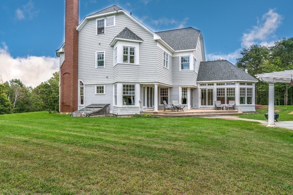 44 Walker Road Manchester, MA 01944 - Photo 6 of 30 a front view of a house with a garden
