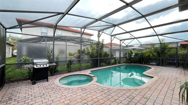 a view of a swimming pool with a patio